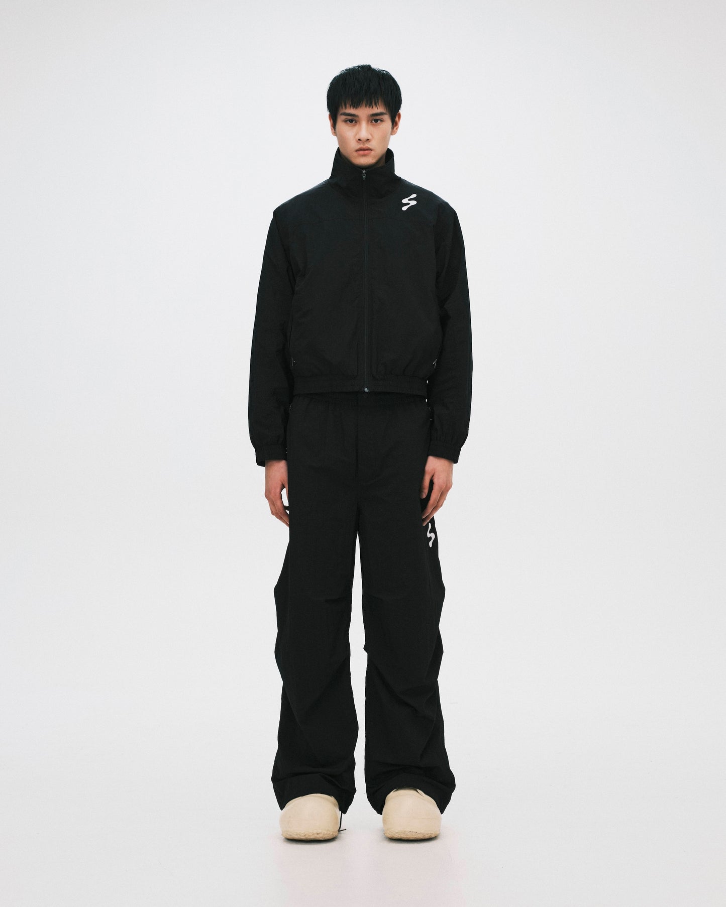 SABUKARU_sabukaru Citizen Track Pants (Black)
