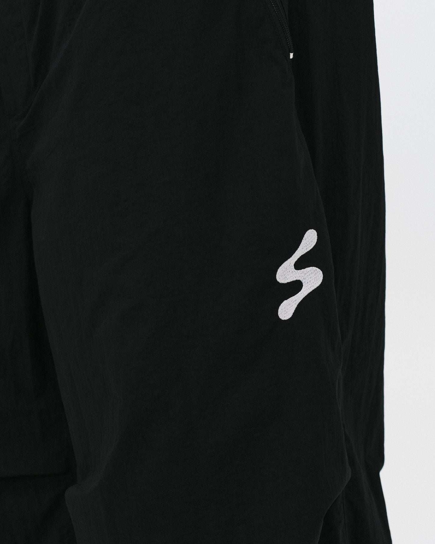 SABUKARU_sabukaru Citizen Track Pants (Black)